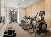 Thumbnail 41 of 83 - a gym with treadmills and other exercise equipment on a wooden wall at 200 City View, Provo