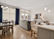 Thumbnail 48 of 83 - a living room and dining room with a couch and a table  at 200 City View, Utah, 84601