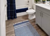 Thumbnail 63 of 83 - a bathroom with a shower and a toilet and a sink at 200 City View, Provo, UT