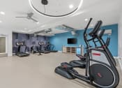Thumbnail 38 of 84 - a gym with treadmills and a tv in the ceiling at The Revival, Salt Lake City