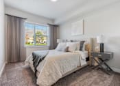 Thumbnail 123 of 136 - a bedroom with a bed and a window at The Flats at Riverwoods, Provo, UT, 84604