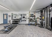 Thumbnail 82 of 136 - the preserve at ballantyne commons fitness room with weights and cardio equipment at The Flats at Riverwoods, Provo, Utah