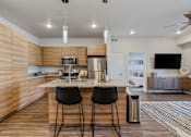 Thumbnail 107 of 136 - a kitchen with a center island with three stools at The Flats at Riverwoods, Provo, UT, 84604