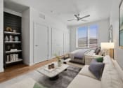 Thumbnail 66 of 126 - a living room with a couch and a ceiling fan  at SevenO2 Main Apartments, Salt Lake City