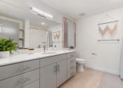 Thumbnail 89 of 131 - a bathroom with a large mirror and a toilet and a sink at Paperbox Lofts, Utah