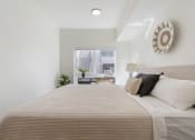 Thumbnail 25 of 131 - a bedroom with a large bed and a window at Paperbox Lofts, Salt Lake City