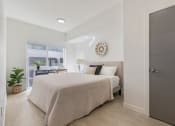 Thumbnail 20 of 131 - a bedroom with a bed and a window at Paperbox Lofts, Salt Lake City