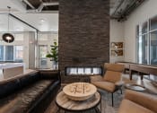 Thumbnail 110 of 131 - a living room with couches and chairs and a fireplace at Paperbox Lofts, Salt Lake City, UT