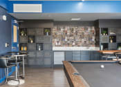 Thumbnail 50 of 131 - a game room with a pool table and a bar at Paperbox Lofts, Utah