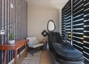 Thumbnail 63 of 131 - a treatment room with a black chair and a mirror at Paperbox Lofts, Salt Lake City, UT