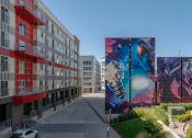 Thumbnail 97 of 131 - a large mural on the side of a building on a city street at Paperbox Lofts, Salt Lake City, UT