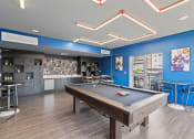 Thumbnail 9 of 131 - a games room with a pool table and a bar at Paperbox Lofts, Salt Lake City, Utah