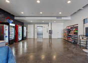 Thumbnail 49 of 131 - a large room with vending machines in the corner of a room at Paperbox Lofts, Salt Lake City