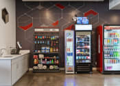Thumbnail 47 of 131 - a convenience store with two refrigerators and a counter with sodas and other drinks at Paperbox Lofts, Salt Lake City, Utah