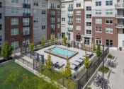 Thumbnail 11 of 83 - an aerial view of a swimming pool in front of an apartment building at 200 City View, Utah
