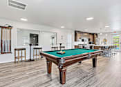 Thumbnail 6 of 74 - a recreation room with a pool table and bar at Red Rock Apartments, Rapid City, South Dakota