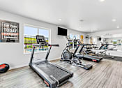 Thumbnail 9 of 74 - a workout room with treadmills and other exercise equipment at Red Rock Apartments, Rapid City, SD, 57702