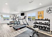 Thumbnail 8 of 74 - a workout room with treadmills and other exercise equipment at Red Rock Apartments, South Dakota 57702