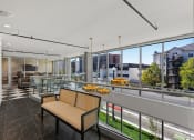 Thumbnail 59 of 84 - a view of a living room from a balcony with glass railing at The Revival, Salt Lake City, 84101