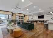 Thumbnail 27 of 84 - a living room with a green couch and a pool table at The Revival, Salt Lake City