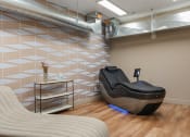 Thumbnail 54 of 84 - a spa room with a massage chair and a couch at The Revival, Salt Lake City, Utah