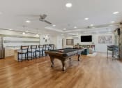 Thumbnail 30 of 84 - a game room with a pool table and a bar at The Revival, Utah, 84101