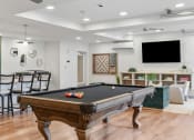 Thumbnail 31 of 84 - a game room with a pool table and a tv at The Revival, Salt Lake City, Utah