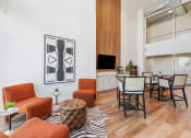 Thumbnail 57 of 84 - a living room with orange furniture and a dining room with a table and chairs at The Revival, Salt Lake City, 84101