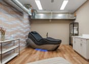 Thumbnail 53 of 84 - a spa room with a massage chair and a sink at The Revival, Salt Lake City, UT, 84101