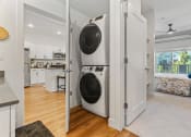 Thumbnail 83 of 84 - a white laundry room with a washer and dryer in it at The Revival, Salt Lake City