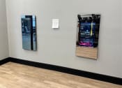 Thumbnail 34 of 126 - a sign is on the wall next to two machines at SevenO2 Main Apartments, Salt Lake City, 84101