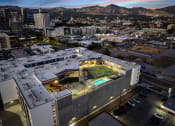 Thumbnail 112 of 126 - an aerial view of a building with a tennis court on top of it at SevenO2 Main Apartments, Salt Lake City