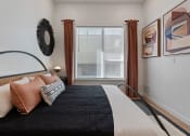 Thumbnail 123 of 126 - a bedroom with a large bed and a large window at SevenO2 Main Apartments, Utah
