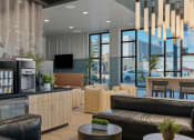 Thumbnail 111 of 126 - a living room with couches and a kitchen and a table at SevenO2 Main Apartments, Salt Lake City, Utah