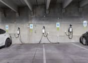 Thumbnail 113 of 126 - an electric car charging in a parking garage at SevenO2 Main Apartments, Utah