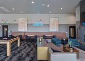 Thumbnail 97 of 126 - a lobby with couches tables and chairs and a pool table at SevenO2 Main Apartments, Salt Lake City, Utah