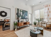 Thumbnail 72 of 126 - an open living room with a couch and a table at SevenO2 Main Apartments, Utah