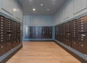 Thumbnail 75 of 126 - a lockers room with blue walls and a wood floor at SevenO2 Main Apartments, Utah