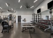 Thumbnail 74 of 126 - weights with mirrors at SevenO2 Main Apartments, Salt Lake City, Utah