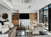 Thumbnail 63 of 136 - a living room with white furniture and a large window at The Flats at Riverwoods, Provo