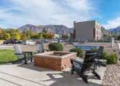Thumbnail 45 of 50 - an outdoor patio with chairs and a fire pit with mountains in the backgroundat The View on 20th, Utah