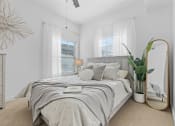 Thumbnail 37 of 50 - a white bedroom with a bed and a mirrorat The View on 20th, Ogden
