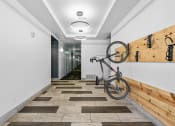 Thumbnail 21 of 50 - a bike hanging on a wall in a hallway with a wood wallat The View on 20th, Ogden