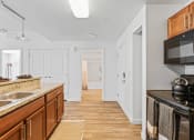 Thumbnail 24 of 50 - a kitchen with a sink and a counter top and a microwaveat The View on 20th, Ogden, Utah