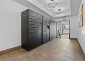 Thumbnail 8 of 50 - a long hallway with black lockers and a corridor with a doorat The View on 20th, Ogden, UT, 84401