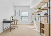 Thumbnail 32 of 50 - a home office with a desk and shelves and a windowat The View on 20th, Utah
