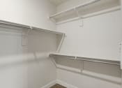 Thumbnail 119 of 136 - a spacious walk in closet in a 555 waverly unit at The Flats at Riverwoods, Utah