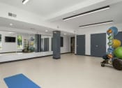 Thumbnail 91 of 136 - a large multipurpose room with white walls and a beige tile floor at The Flats at Riverwoods, Provo, UT