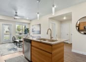 Thumbnail 110 of 136 - the enclave at homecoming terra vista kitchen and living room at The Flats at Riverwoods, Utah