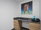 Thumbnail 70 of 136 - a painting of a dog on the wall of a bathroom at The Flats at Riverwoods, Utah, 84604